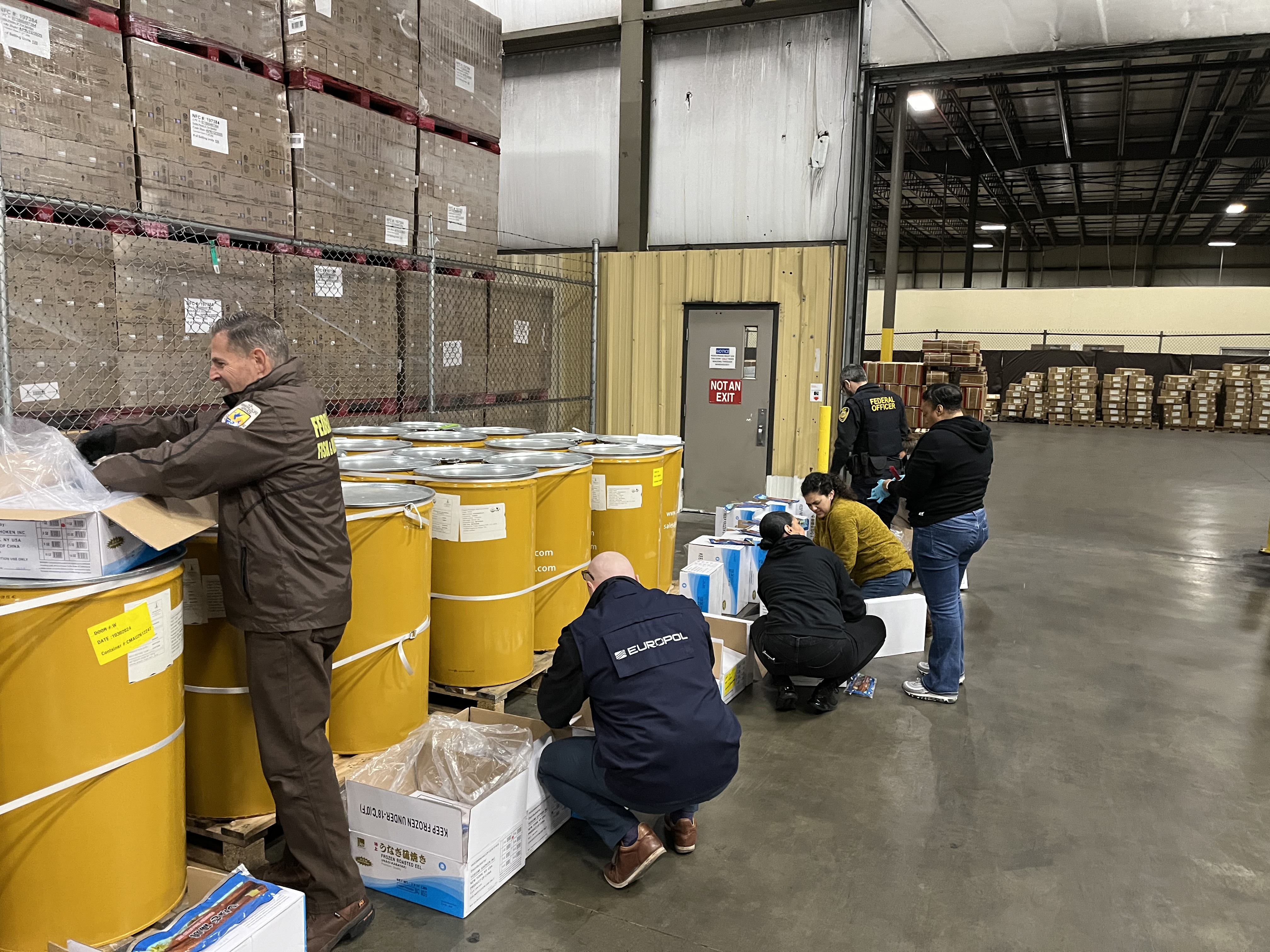 NOAA enforcement staff, U.S. Fish and Wildlife Service, and a Europol law enforcement liaison inspect imported seafood at the Port of Newark, New Jersey.