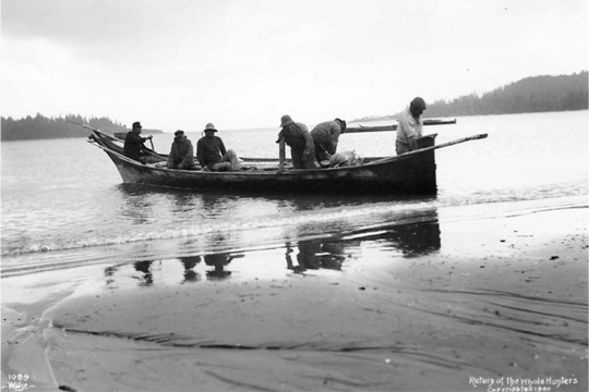 Makah Tribe in hand-carved canoes
