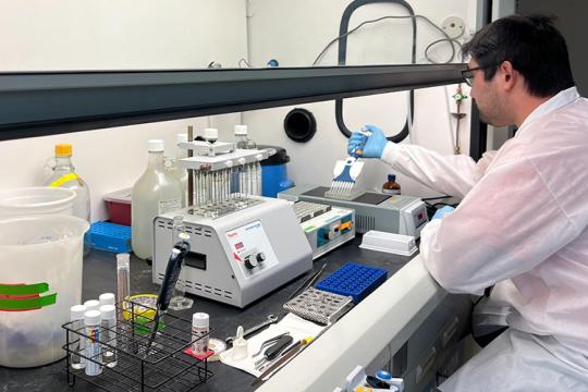 Scientist using lab equipment