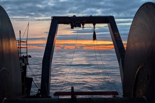 Sun setting over the ocean as seen aboard a research vessel