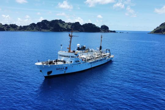 A view of the NOAA Ship Rainier during the last RICHARD cruise to the Marianas, anchored in Maug.