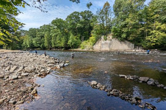 Anglers fish in the Salmon River, shown here after several structures associated with an abandoned railroad trestle bridge were removed. Credit: New York State Department of Environmental Conservation.