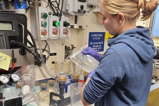 A scientist filters water samples in the R/V Bell M. Shimada Chemistry Lab