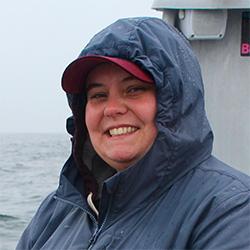 Woman smiling with coat hood on