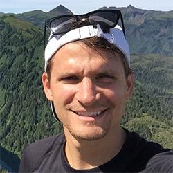 Man smiling with landscape background