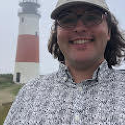 Olive Bender in front of lighthouse.