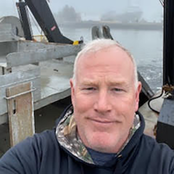 Chad Keith onboard fishing vessel on a foggy day. 