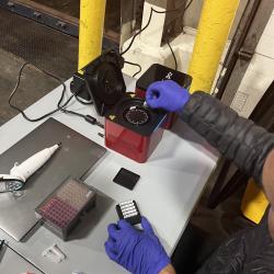 Florida International University scientist Diego Cardeñosa inserts the collected samples from imported fish into the PCR device to identify the fish species.