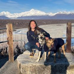 Jenna Malek with her dogs and mountains in the background