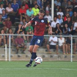 Jan Willem Staman running after a soccer ball. 