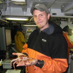 Jonathan Duquette holding a crab.