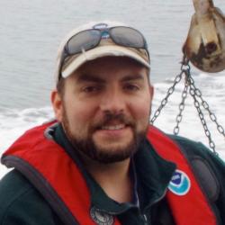 Justin Stevens wearing pfd at sea.