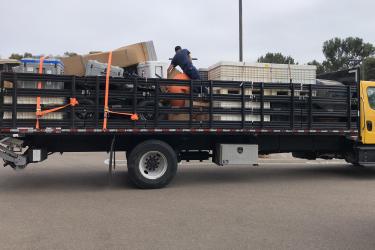 NOAA staff packing a truck full of gear to ship to Chile and then on to Antarctica 