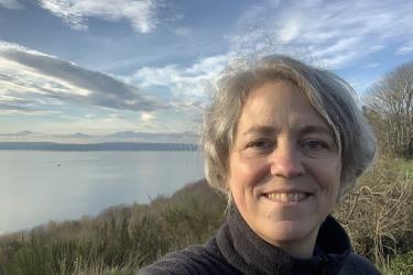 picture of woman next to water