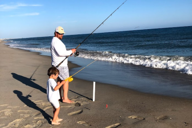 Tim Sartwell fishing with son