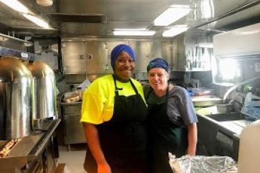 Ashely Cosme (left) and Arlene Beahm (right) in the galley (kitchen) on the Oregon II
