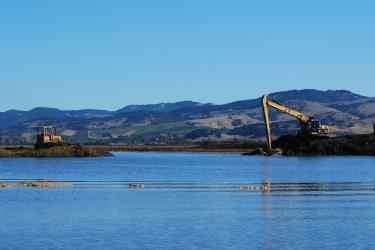 Construction equipment in a tidal marsh habitat in American Canyon, California.
