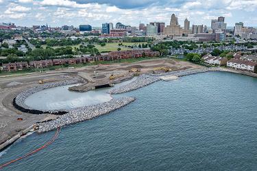 Aerial view of construction equipment along a shoreline park