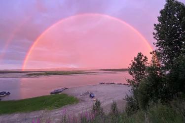 Rainbow during sunset in Alaska. 