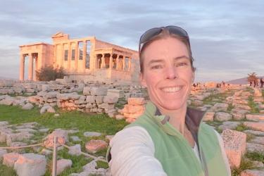 Sarah in front of ruins.  