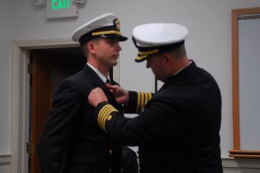 Ben VanDine being pinned during transfer ceremony.