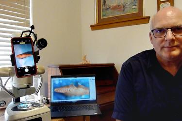 Scientist in front of equipment 