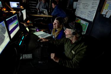Dave Paker and Meredity in control room during expedition.