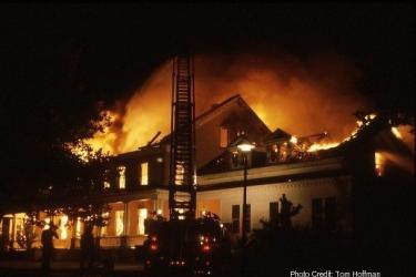 Sandy Hook Lab on fire, ladder truck in front of burning building.
