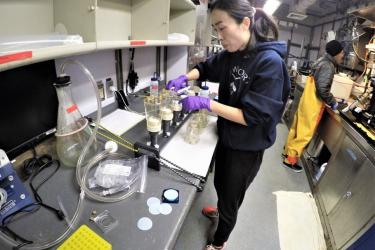 Testing water samples aboard ship.