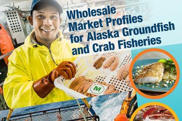 Man wearing blue hat, yellow jacket and orange gloves holding up seafood. 