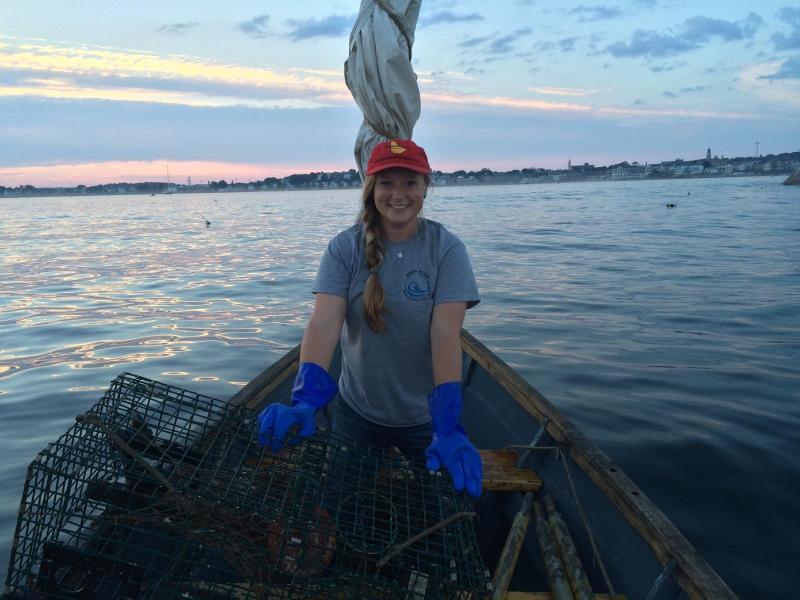 Samantha Tolken working on the water with lobster traps.