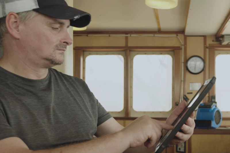 Fishermen with tablet