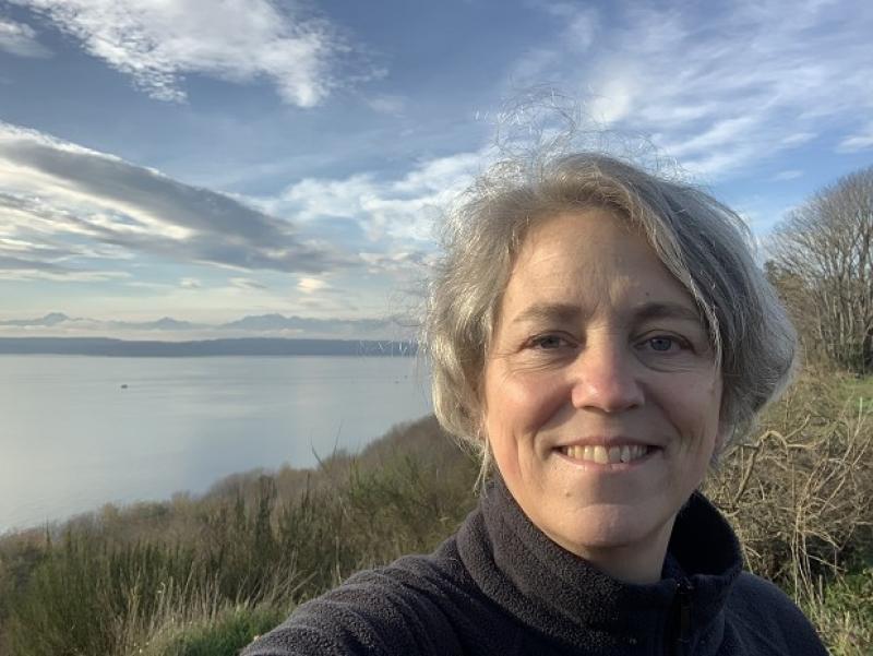 picture of woman next to water