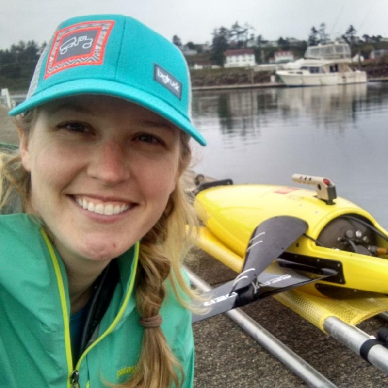 A photo of Selene Fregosi with a Seaglider in the background.