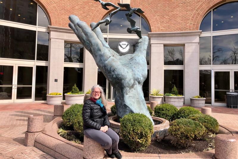 Cathy Tortorici sits outside of NOAA Fisheries Headquarters building 