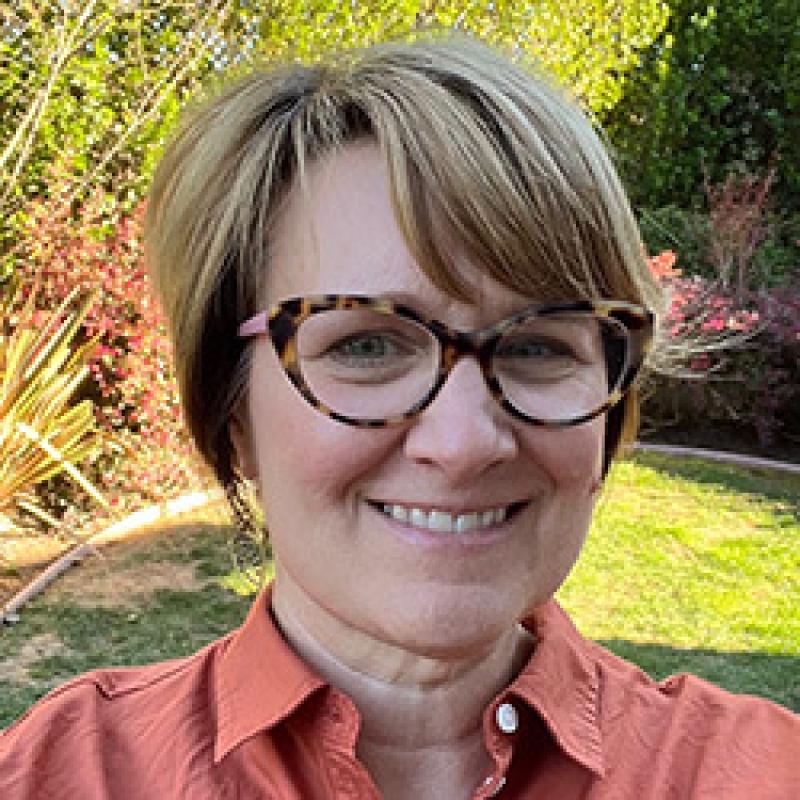 Headshot of Korie Schaeffer smiling at the camera