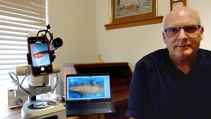 Scientist in front of equipment 