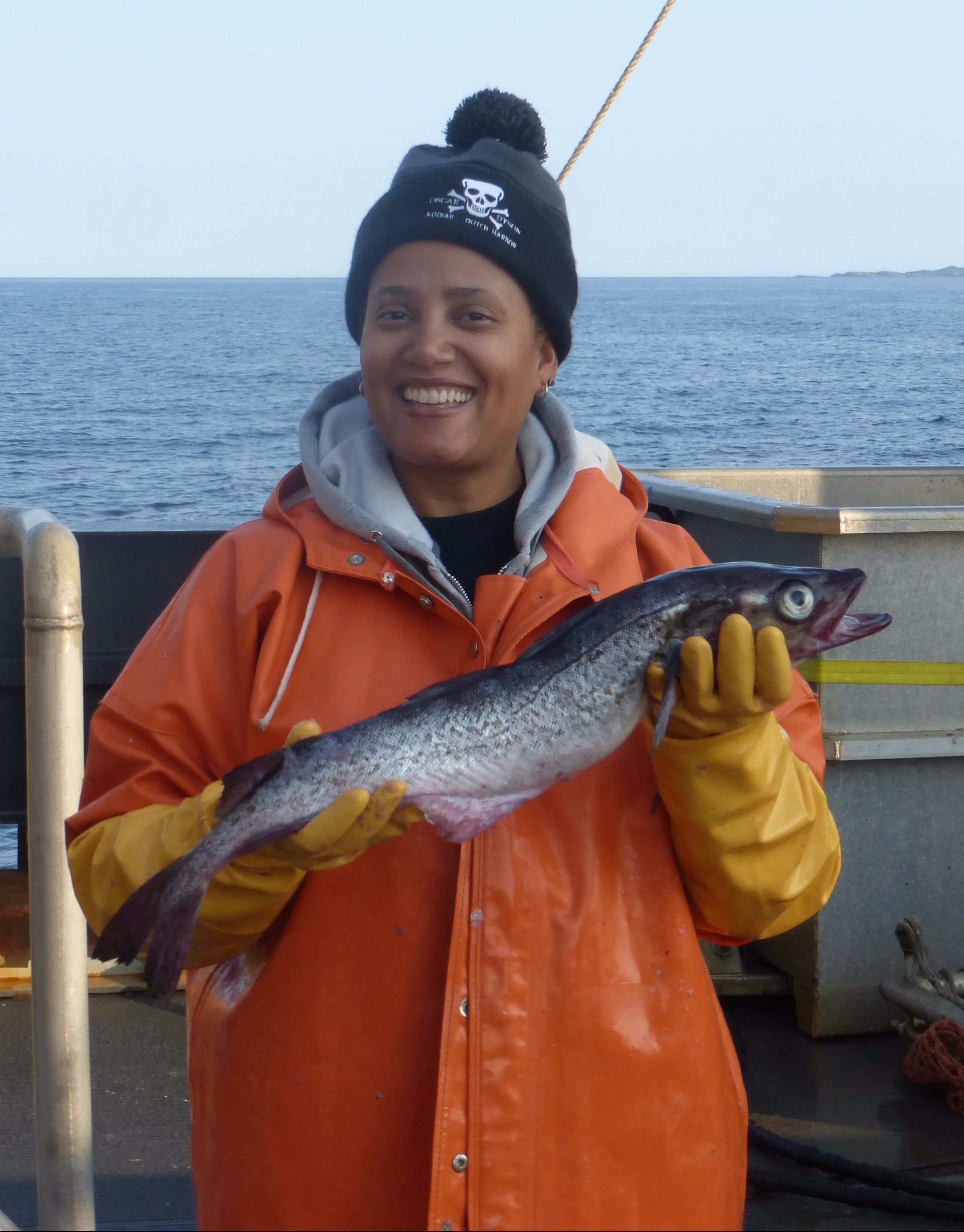 Teacher at Sea Sian Proctor holding a pollock