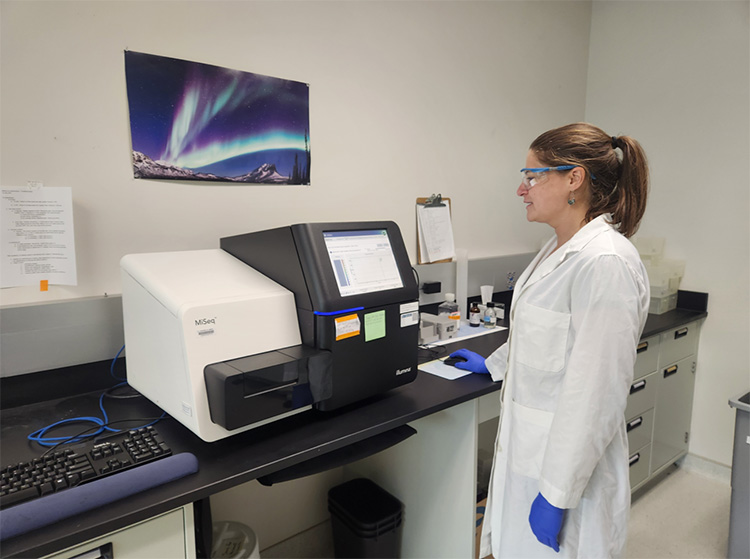 Scientist with lab work and scientific equipment