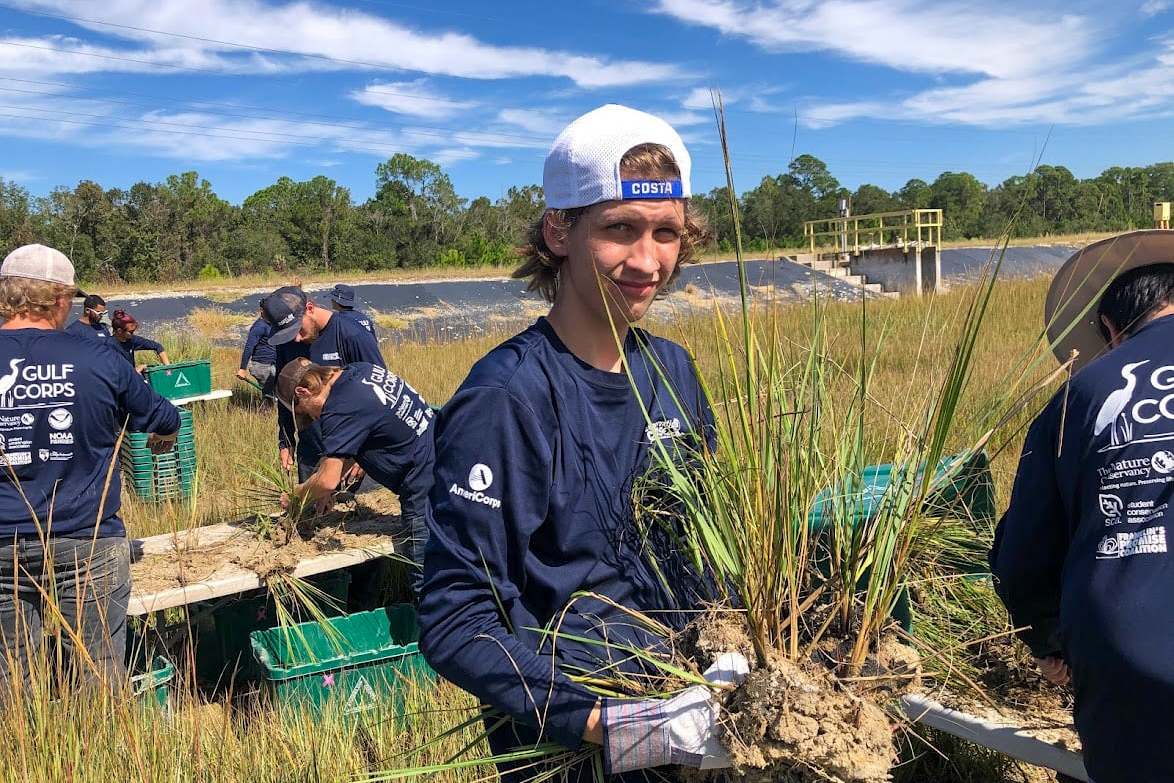 OysterCorps members planting marsh grasses (Photo: Franklin’s Promise Coalition)