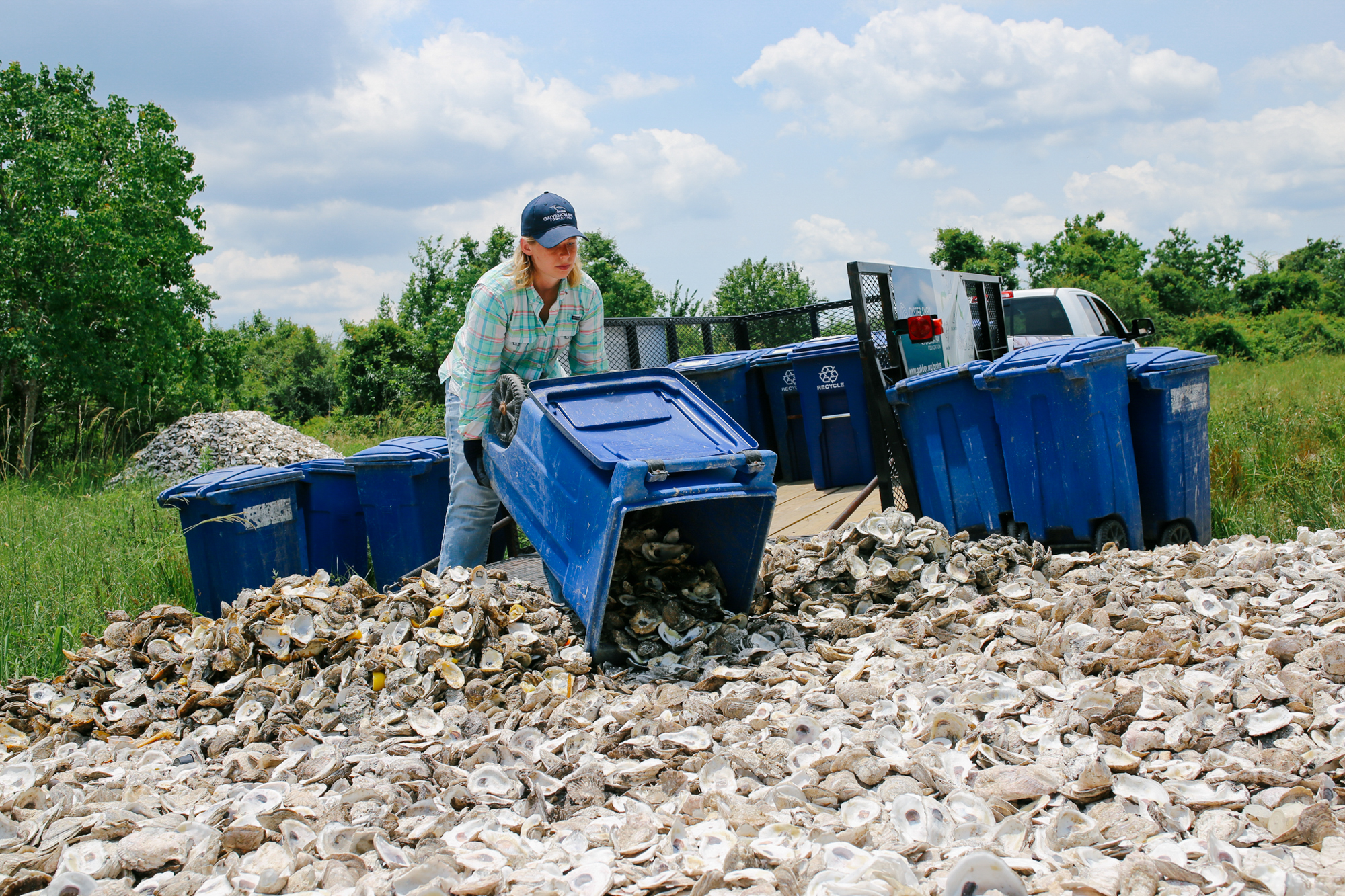 Unloading oyster shells collected from restaurants to cure in the sun. (Photo: Galveston Bay Foundation)