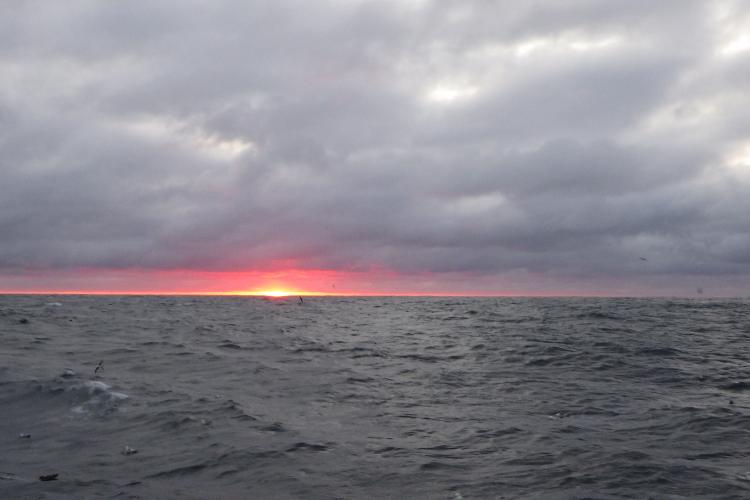 A sunrise over the Bering Sea. Credit: Rory Morgan, Alaska Observers Inc. Edited by NOAA Fisheries
