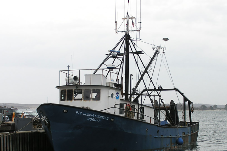 The Gloria Michell tied to dock, trawl gear can be seen. 