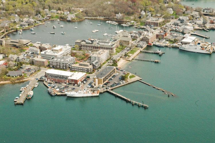 Aerial view of Woods Hole, showing various labs and Eel Pond. 