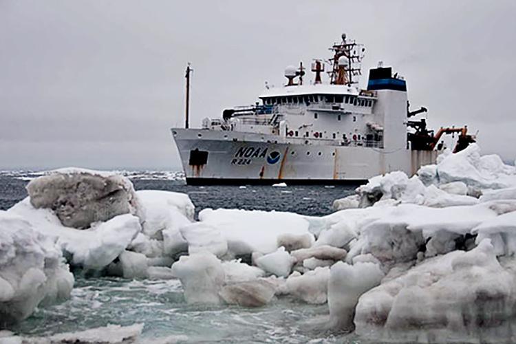 Ship on water with ice in the foreground