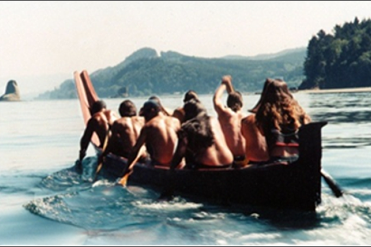 Members of the Makah Tribe rowing a boat