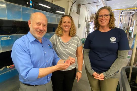 A photo of Jennifer Doerr and Jennifer Leo in the Galveston Laboratory alongside Dr. Spinrad