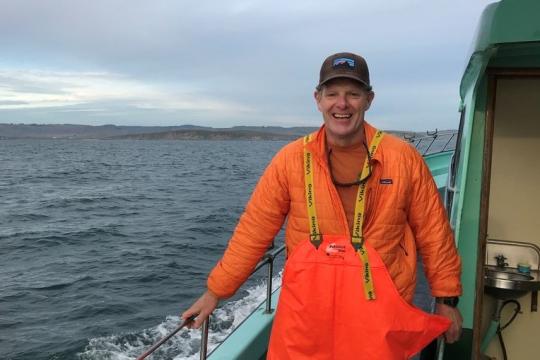 Nate Mantua off the coast of Sonoma County on a charter boat that is part of the cooperative salmon sampling program.