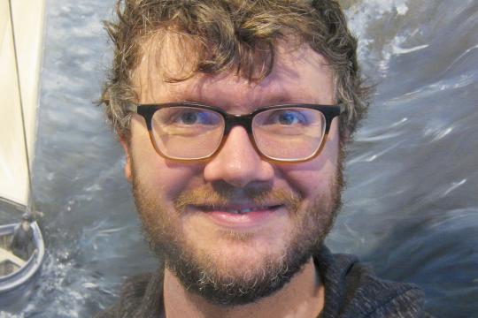 Portrait of scientist with glasses smiling