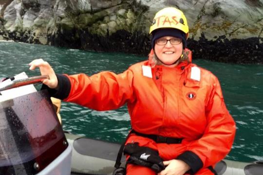 Teacher-at-Sea Mary Cook in zodiac.